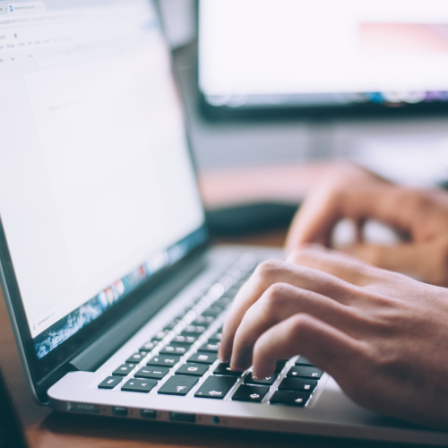 hand writing a cover letter