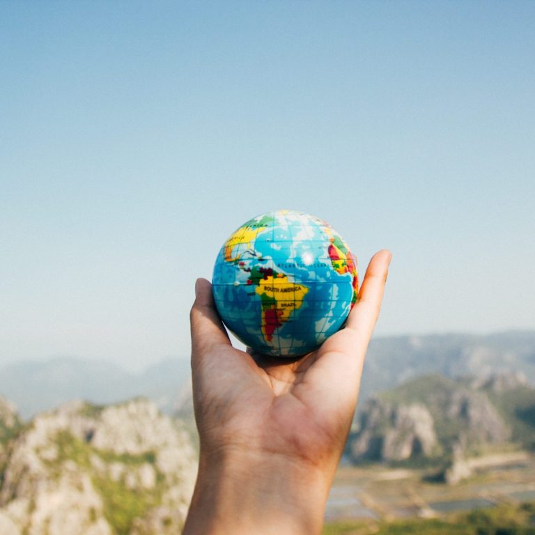 hand holding planet earth